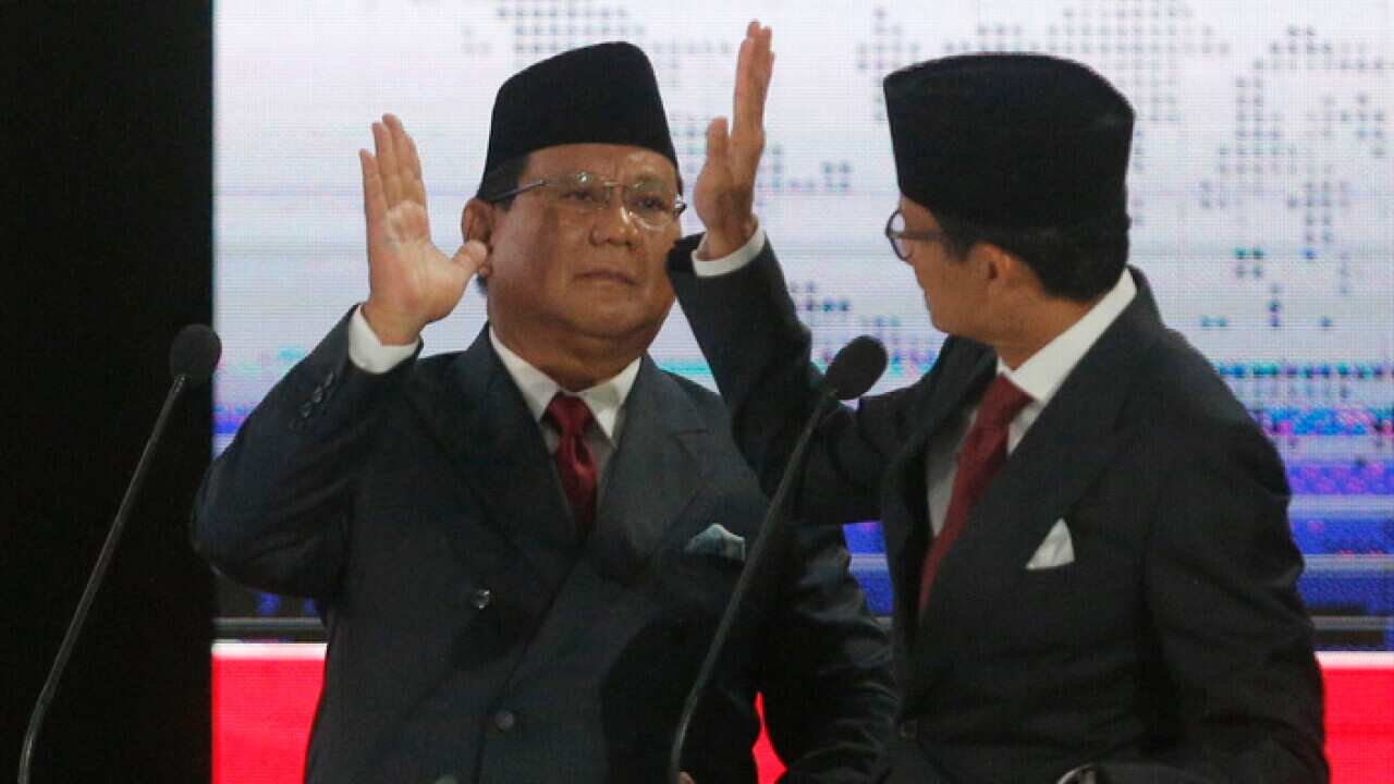 Indonesian presidential candidate Prabowo Subianto, left, with running mate Sandiaga Uno
