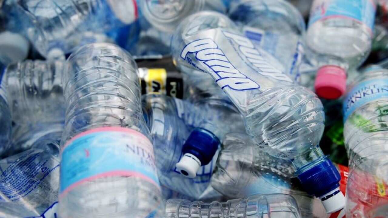 File image of empty plastic bottles packed inside a shopping trolley.