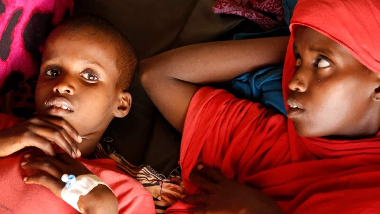Malnourished children wait for treatment in Somalia