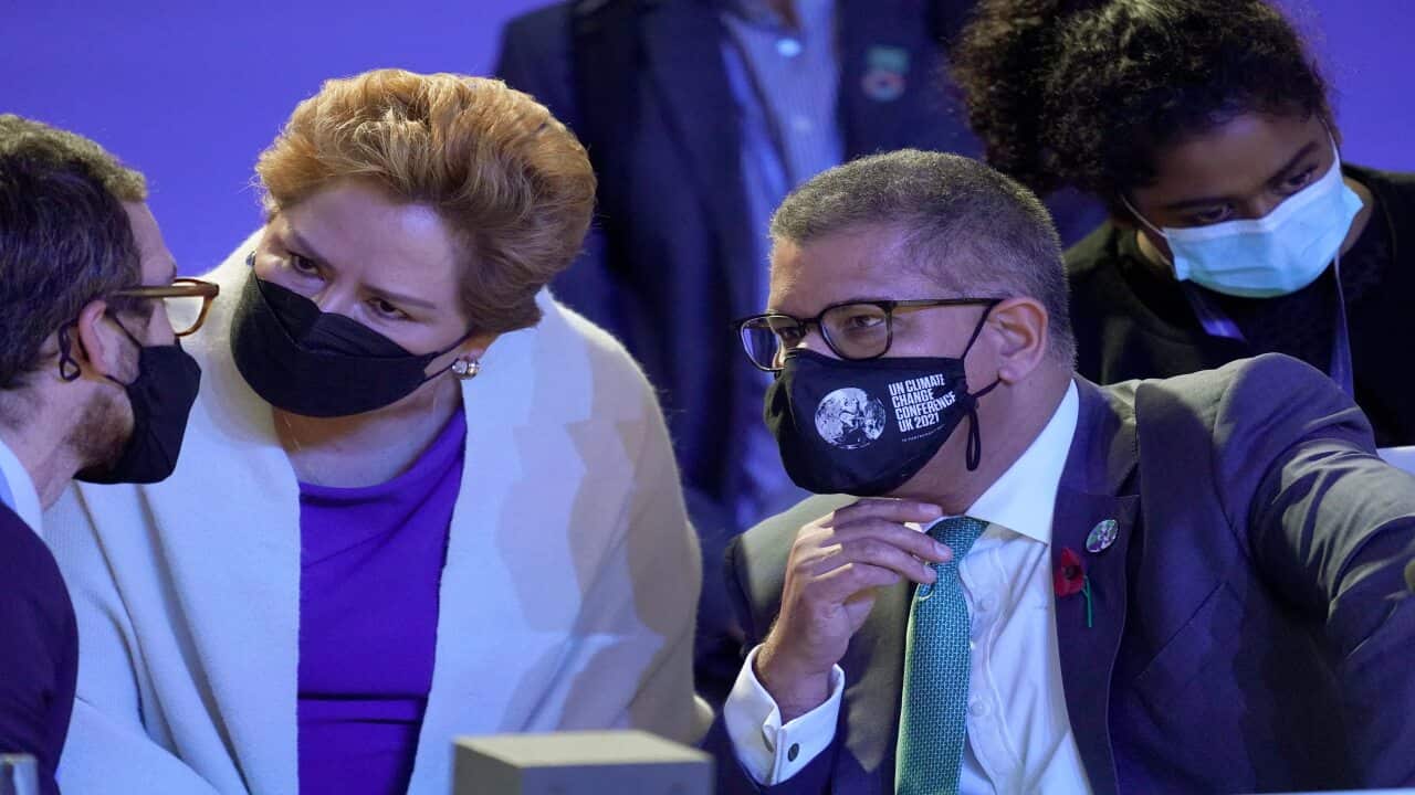 Alok Sharma President of the COP26 summit, and Patricia Espinosa, UNFCCC Executive-Secretary, second left, speak at the COP26 UN Climate Summit, 12 November.