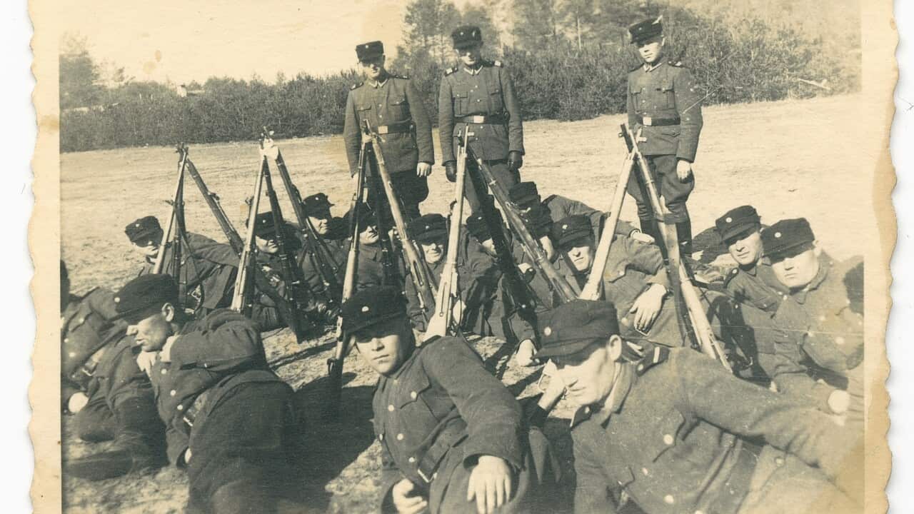This 1943 photo provided by the US Holocaust Memorial Museum shows a group of auxiliary guards at the Nazi death camp Sobibor in German-occupied Poland.