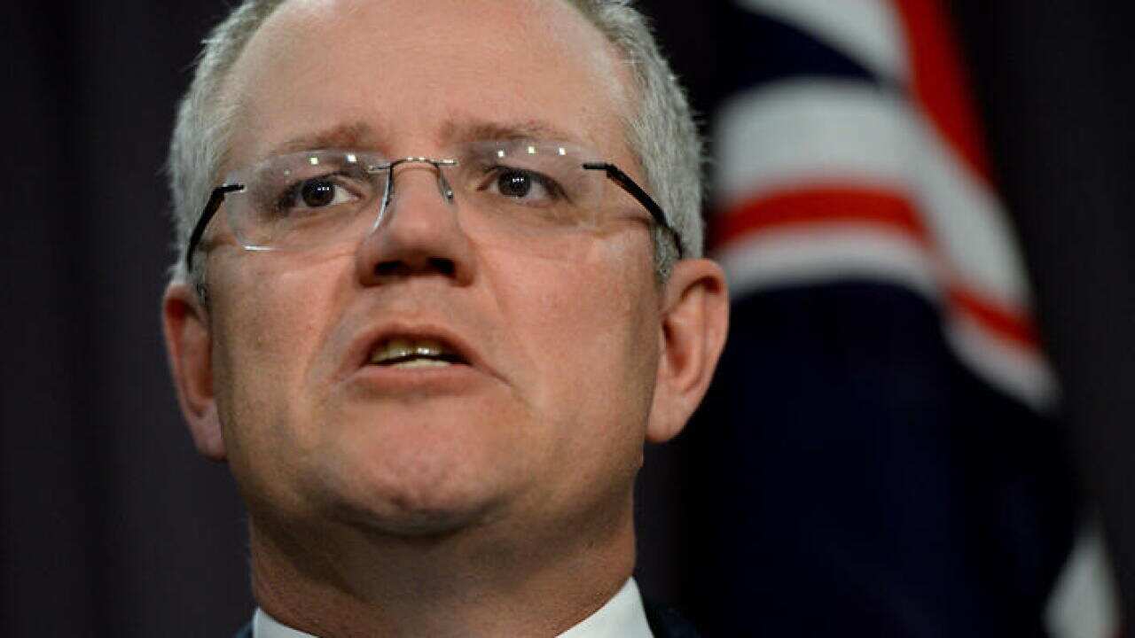 Australian Treasurer Scott Morrison speaks during a press conference at Parliament House in Canberra