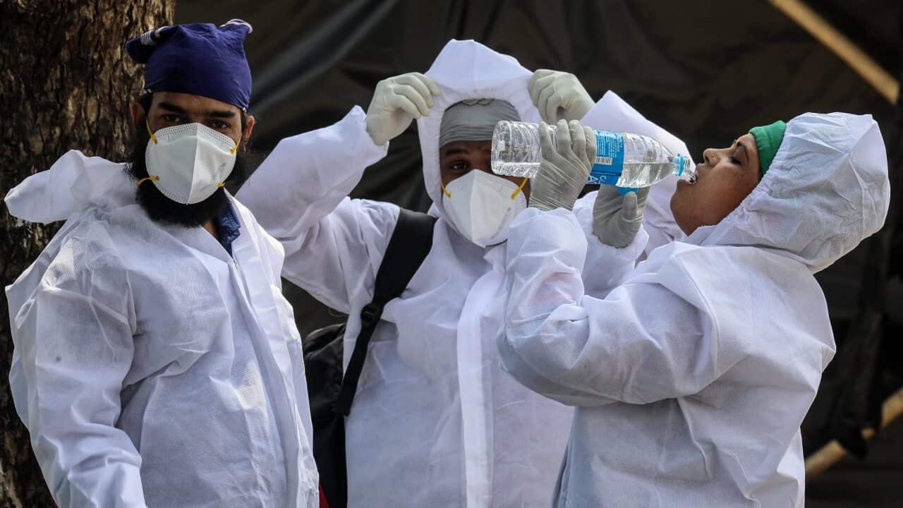 Health workers at a COVID-19 centre in Mumbai, India on 24 May 2021.