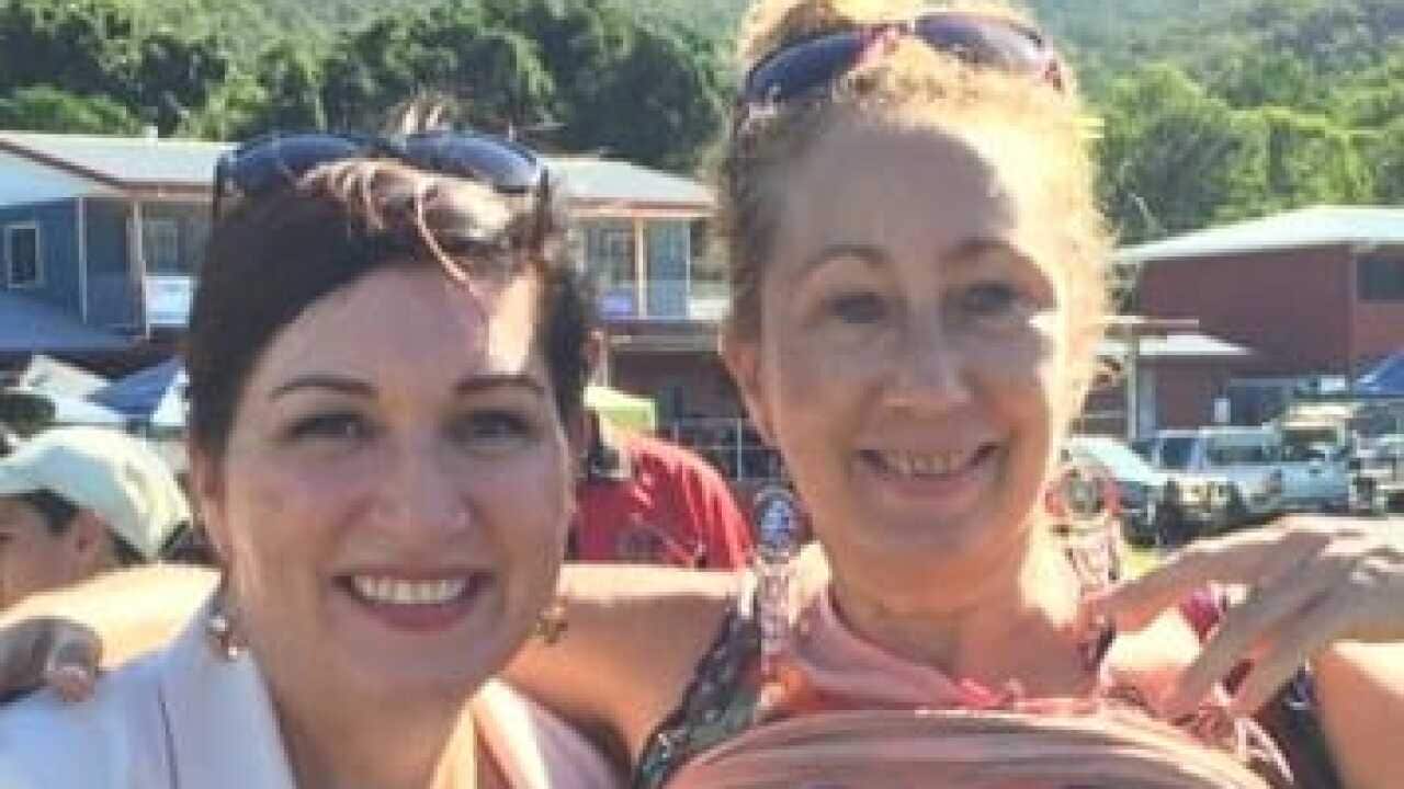Queensland Environment Minister Leanne Enoch poses with a Stop Adani activist at an Indigenous festival near Cairns.