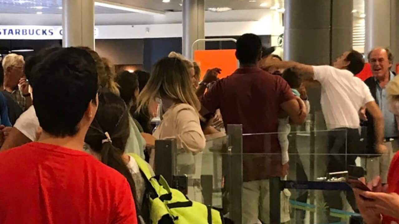 A photo captured by Twitter user @ArabellaArkwri1 claims to show an airport worker assaulting a man holding a baby.