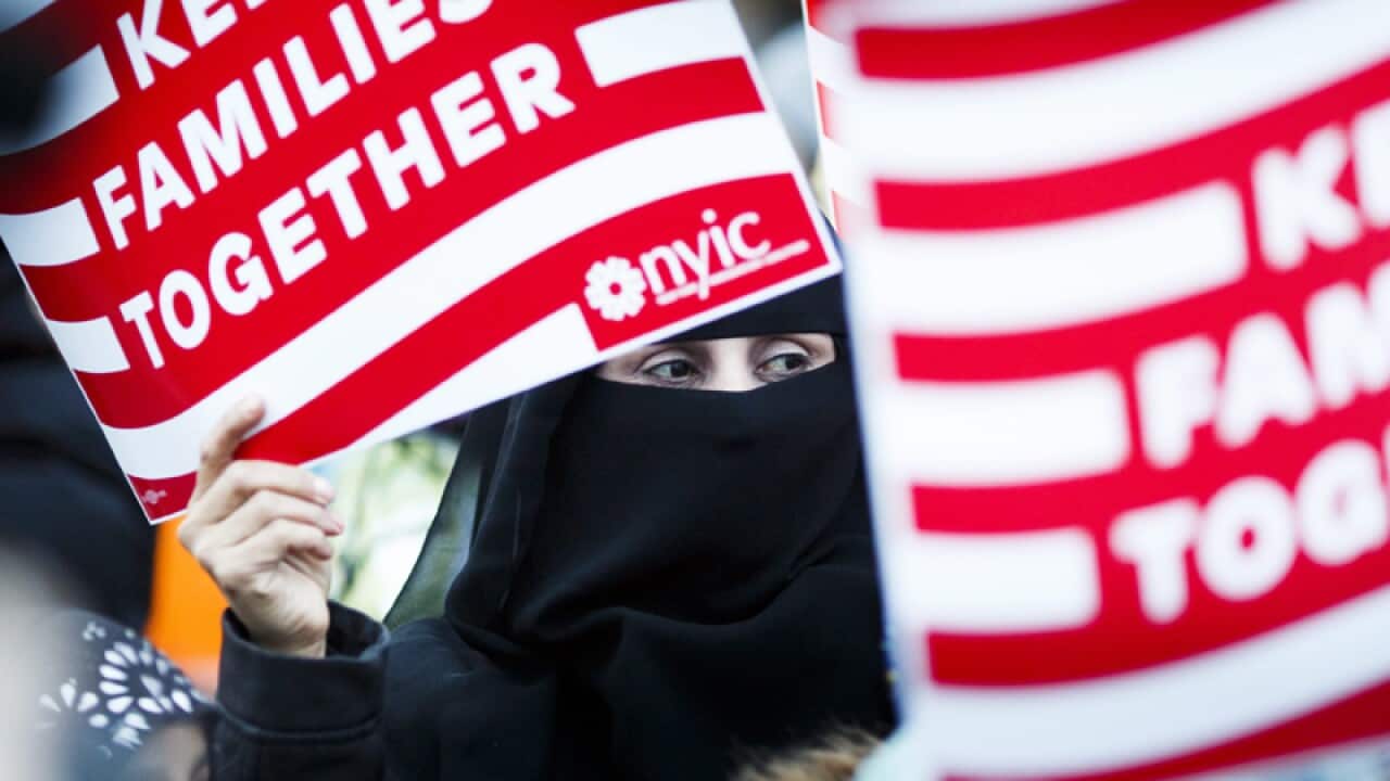 People rally against the US ban on Muslims in New York