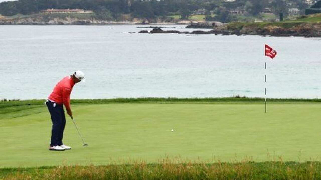 A man playing golf.