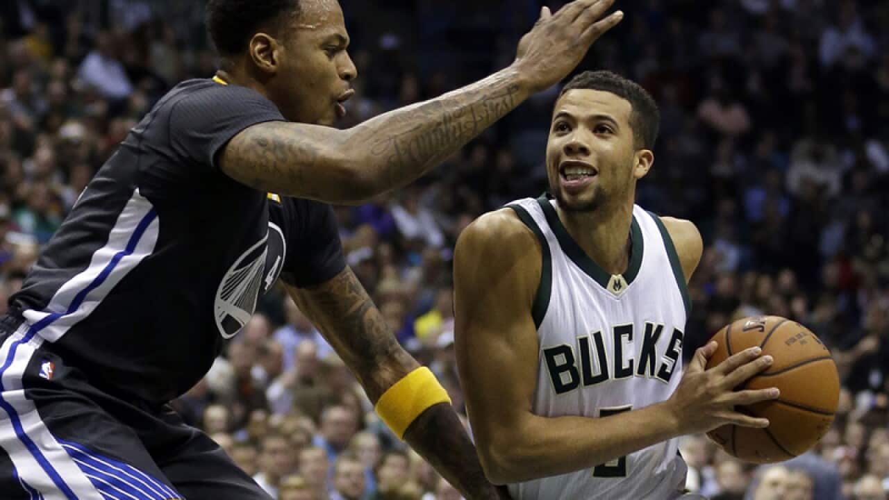 Michael Carter-Williams and Golden State Warriors' Brandon Rush