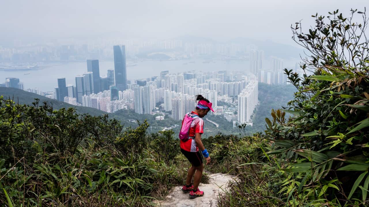 Jaybie Pagirigan, a Filipina domestic worker, with a 3-year-old she takes care of, in Hong Kong, March 16, 2019. Trail running has emerged as an unlikely equalizer for some foreign domestic workers in a city that often discriminates against them. (Xyza Cr