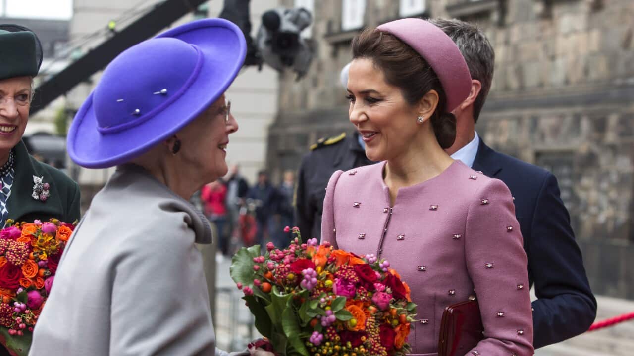 Queen Margrethe of Denmark greets Australian-born Princess Mary
