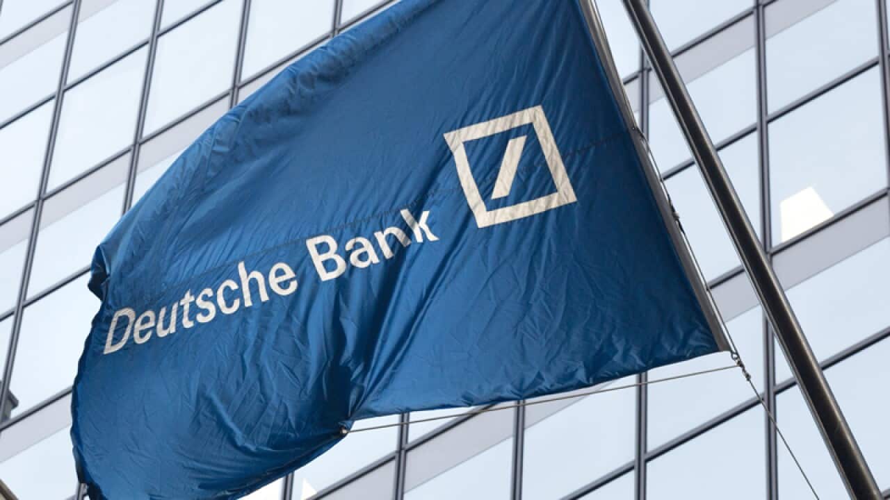 The Deutsche Bank flag flies.