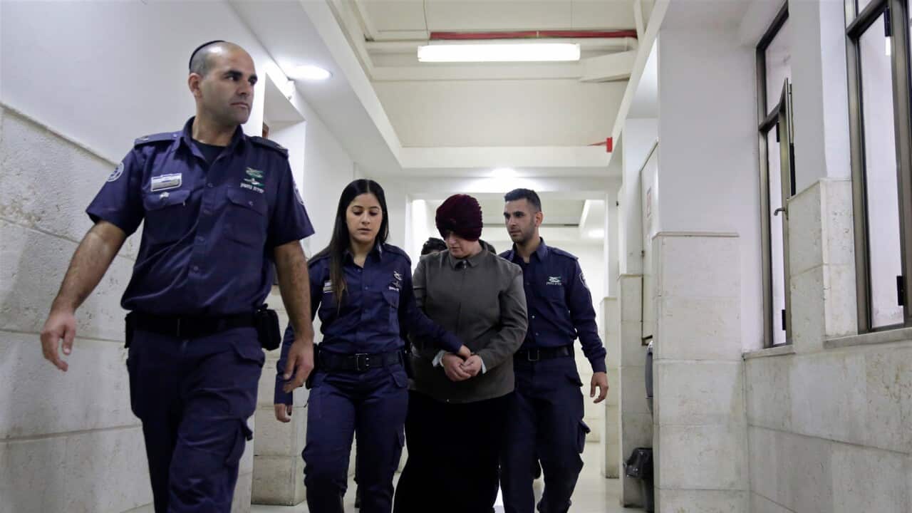 Australian Malka Leifer is brought to a courtroom in Jerusalem, Tuesday, Feb. 27, 2018. An Israeli court said Tuesday that Leifer who is accused of sex crimes will not be extradited for reasons of mental illness. (AP Photo/Mahmoud Illean)