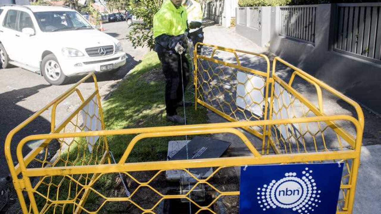 Contractors working with the rollout of the NBN network are seen in Sydney, Monday, July 10, 2017.