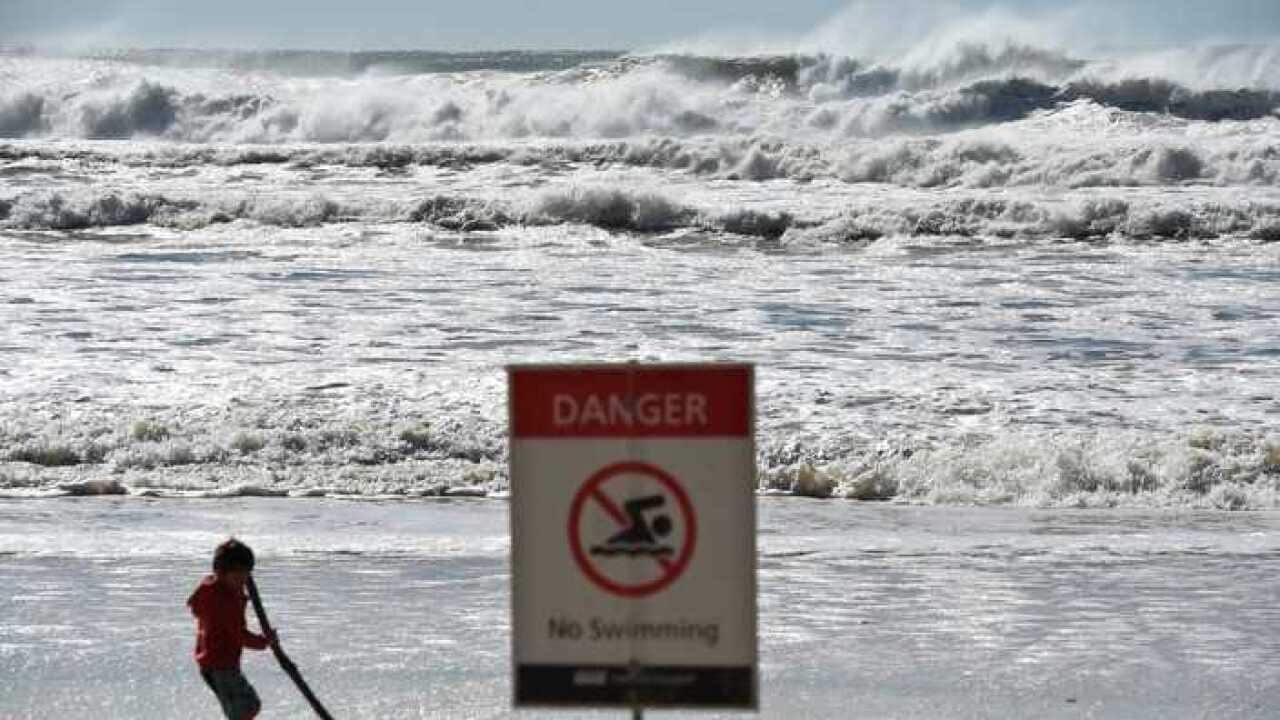 A sign informing the beach is closed