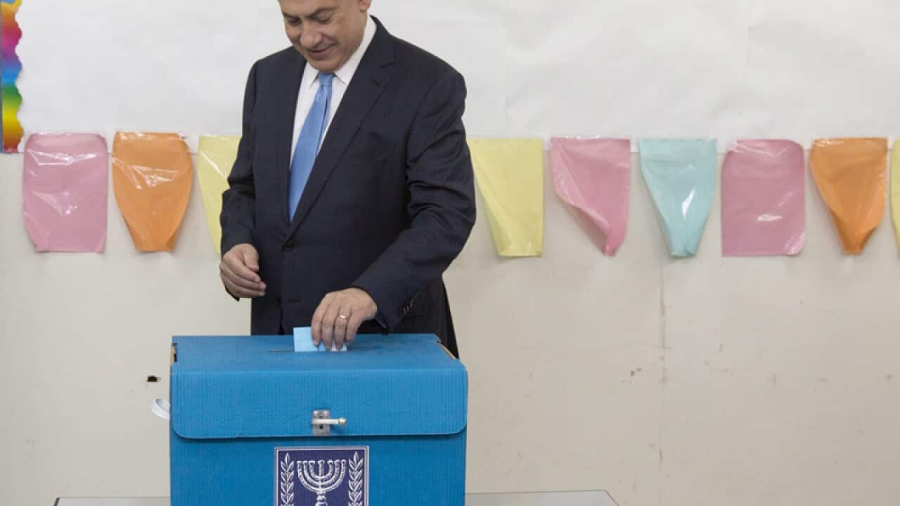 Israeli Prime Minister Benjamin Netanyahu casts his vote