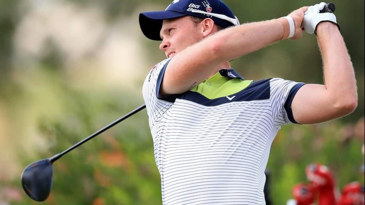 Danny Willet of England tees off.