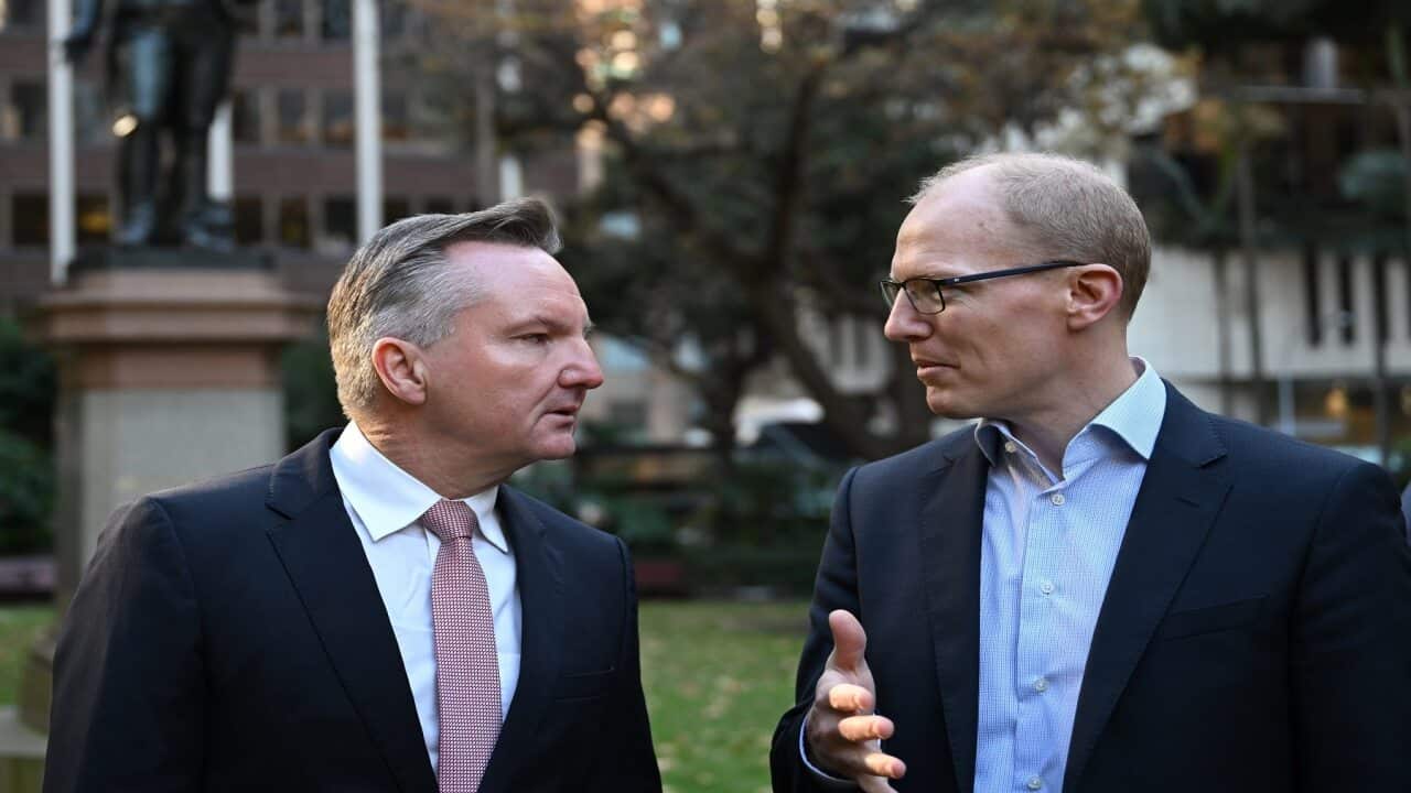 Federal Minister for Climate Change and Energy Chris Bowen (left) chats with AEMO chief executive Daniel Westerman