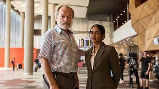 Hugo Weaving and Shabana Azeez during filming, with camera crew.