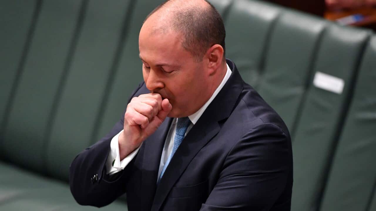 Treasurer Josh Frydenberg has a coughing fit as he makes a ministerial statement to the House of Representatives at Parliament House in Canberra, Tuesday, May 12, 2020. (AAP Image/Mick Tsikas) NO ARCHIVING