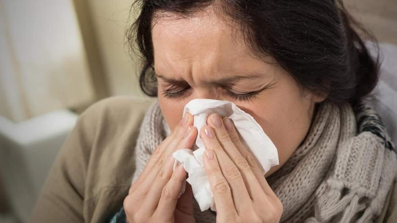 Woman blowing njose