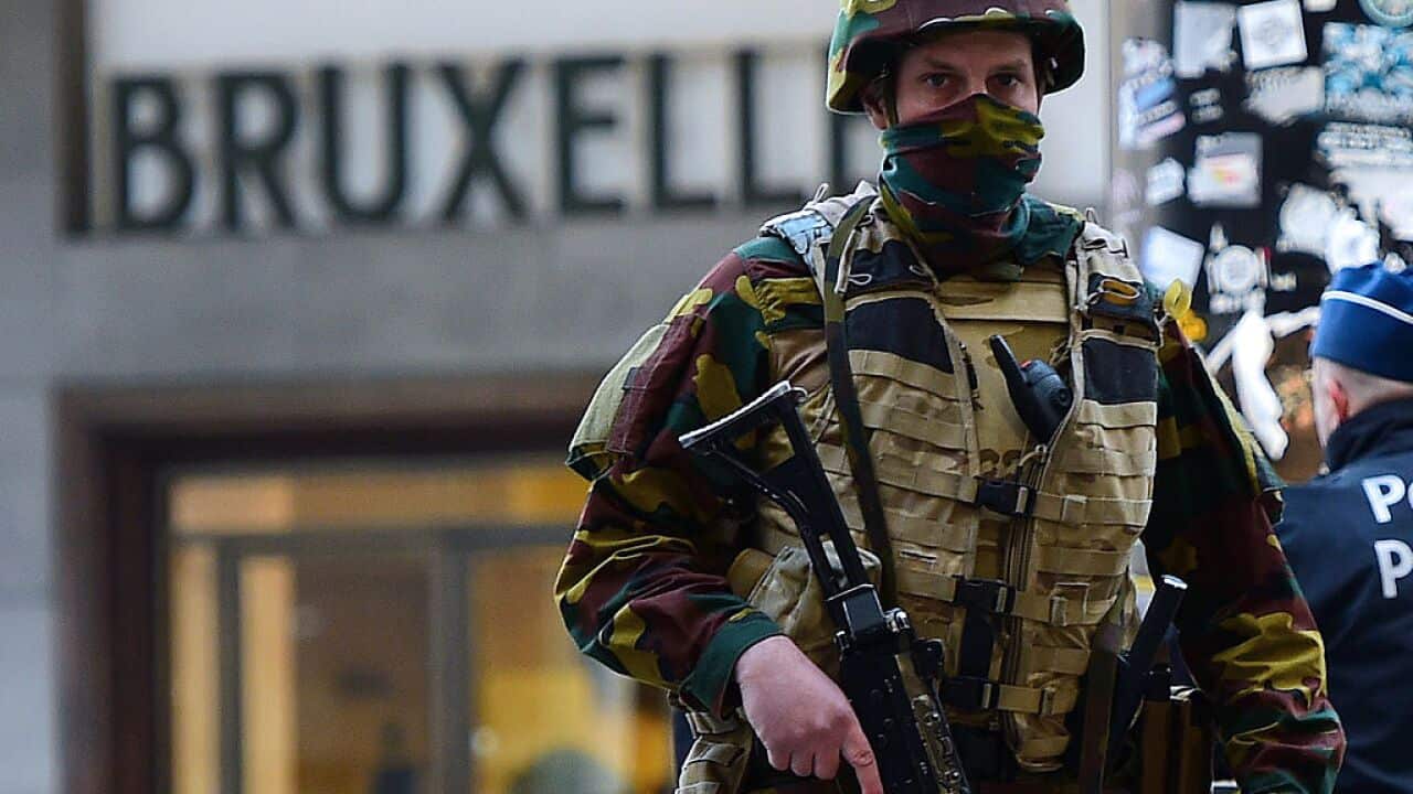 A Belgian soldier patrols outside Brussels Central Station