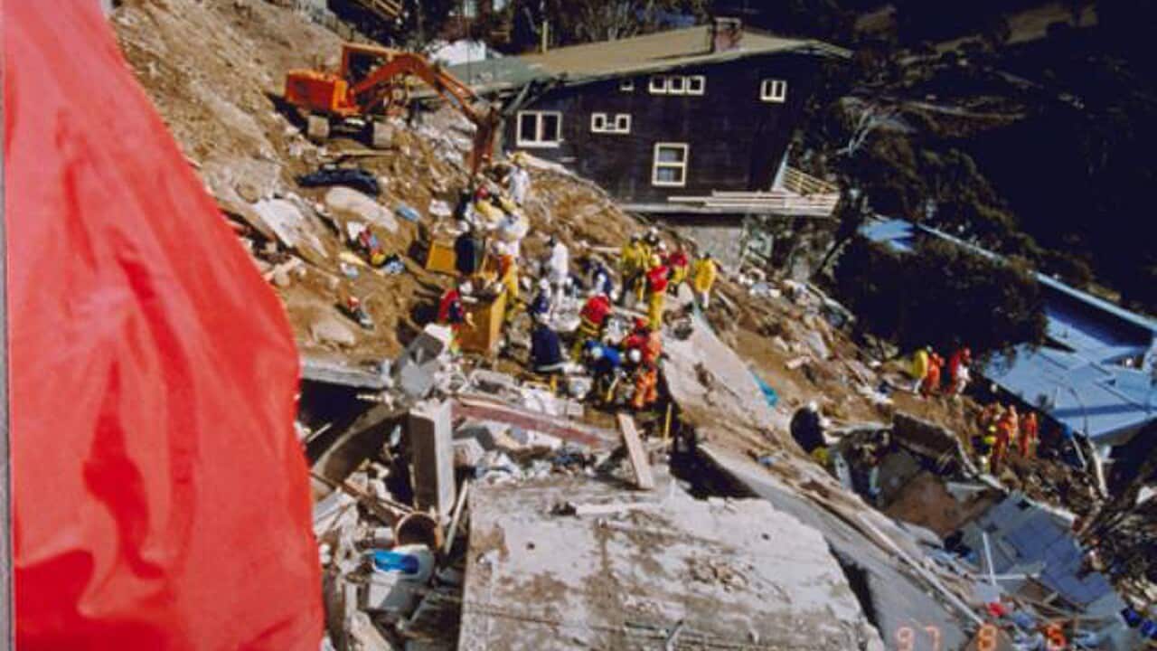 Remnants of landslide and rescue crew.