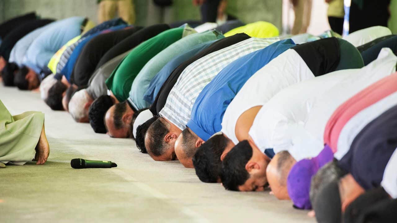 Men pray during the call to prayer at the open day of the Australian Islamic Centre in Newport. Melbourne.