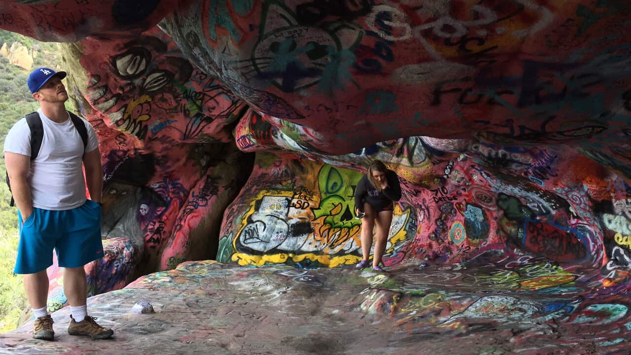 Tourists visit the Corral Canyon Cave in Malibu, Calif., Friday, May, 6, 2016.