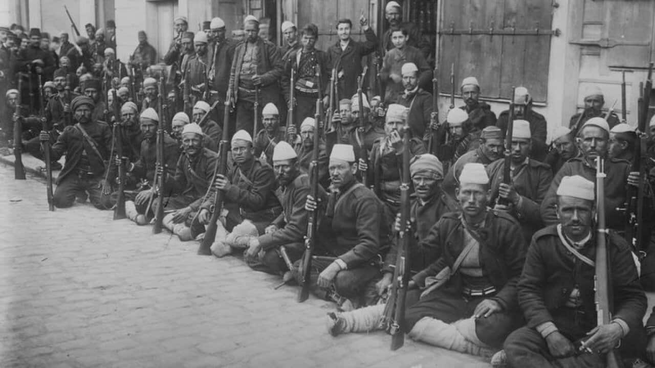 Turkish Infantry Unit Poses with their rifles and wearing Traditional Garb