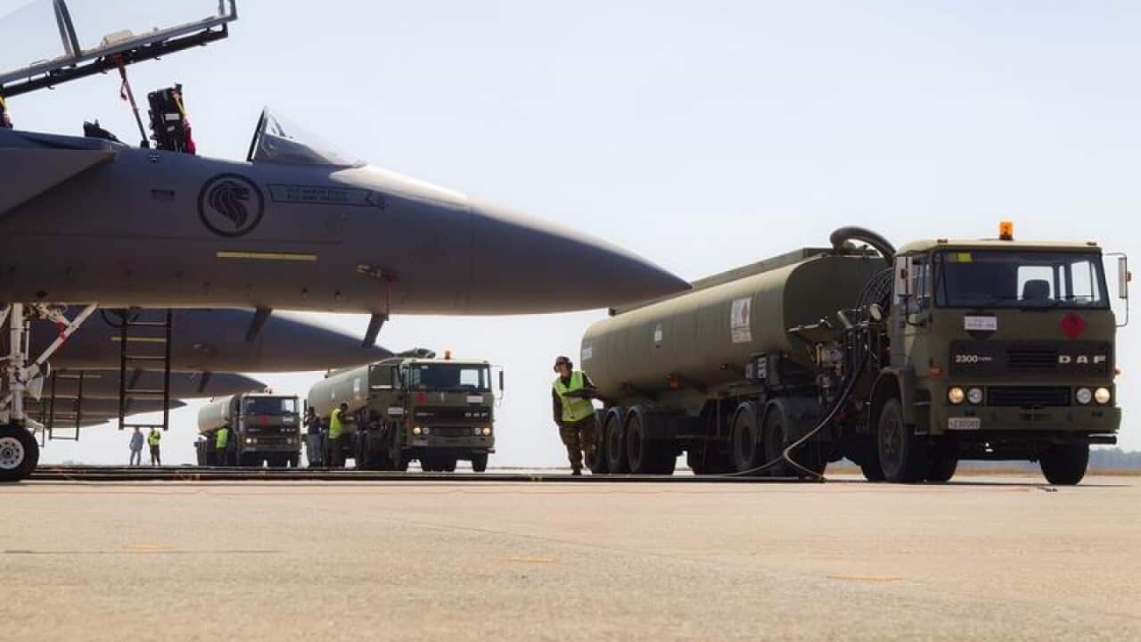Ground support crews on the flightline of RAAF Base Darwin.