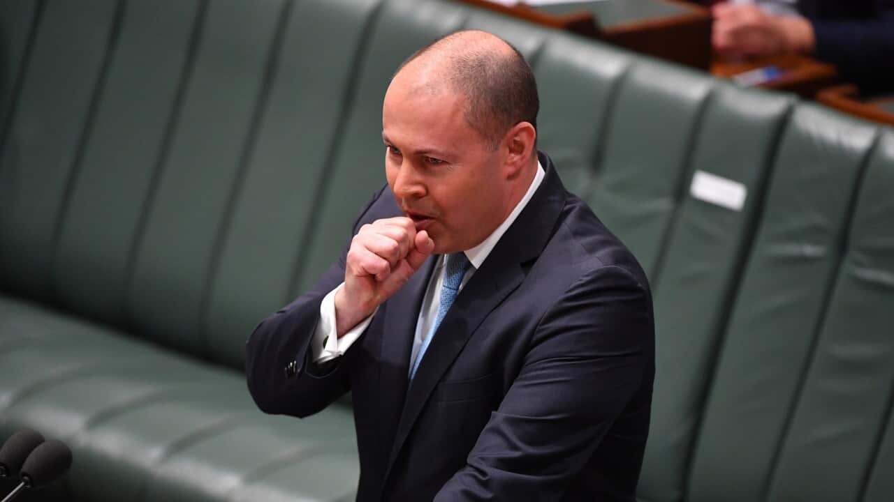 Treasurer Josh Frydenberg has a coughing fit as he makes a ministerial statement to the House of Representatives at Parliament House in Canberra, Tuesday, May 12, 2020. (AAP Image/Mick Tsikas) NO ARCHIVING