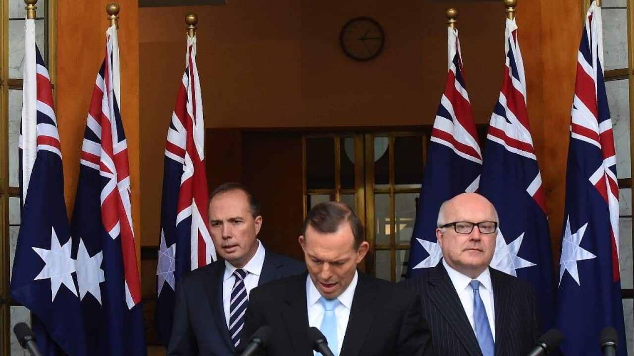 Minister for for Immigration Peter Dutton, Prime Minister Tony Abbott and Attorney-General George Brandis at a press conference at Parliament House in Canberra, Tuesday, June 23, 2015. (AAP Image/Mick Tsikas) NO ARCHIVING