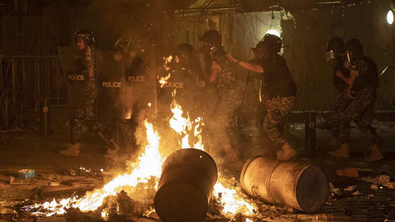 Riot police advance to push back anti-government protesters in Lebanon