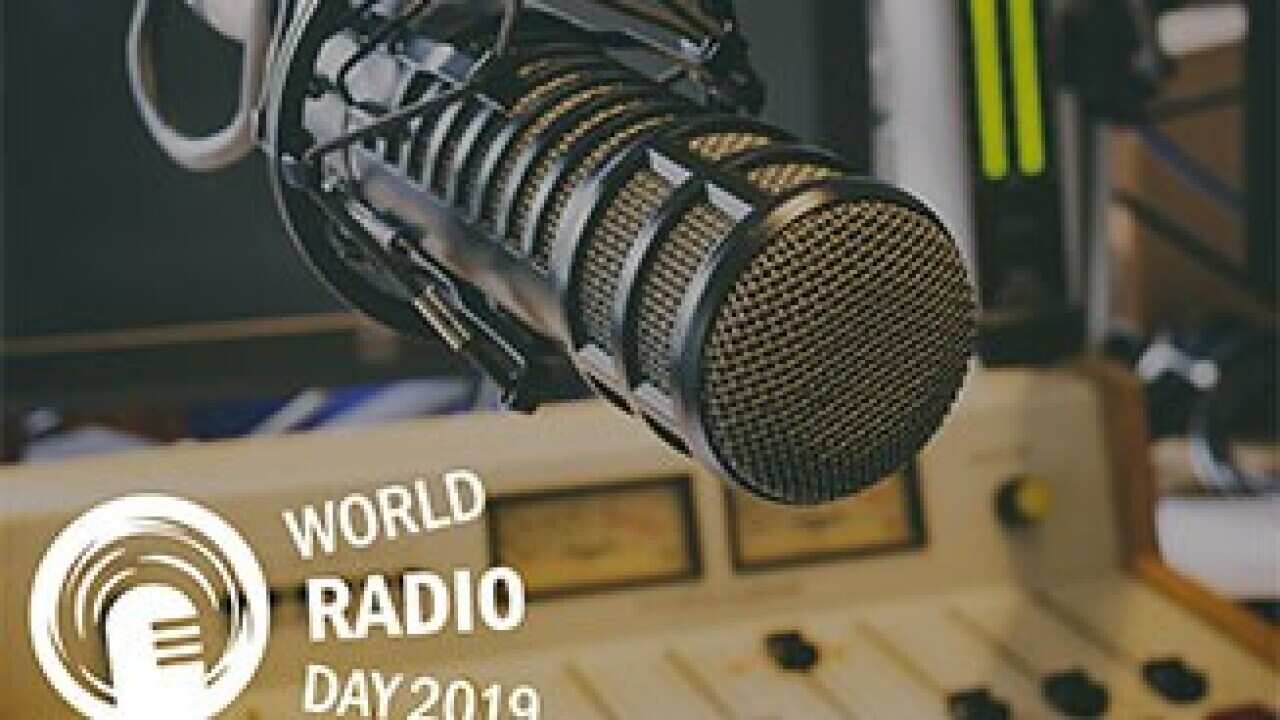 Radio studio and microphone with text World Radio Day 2019