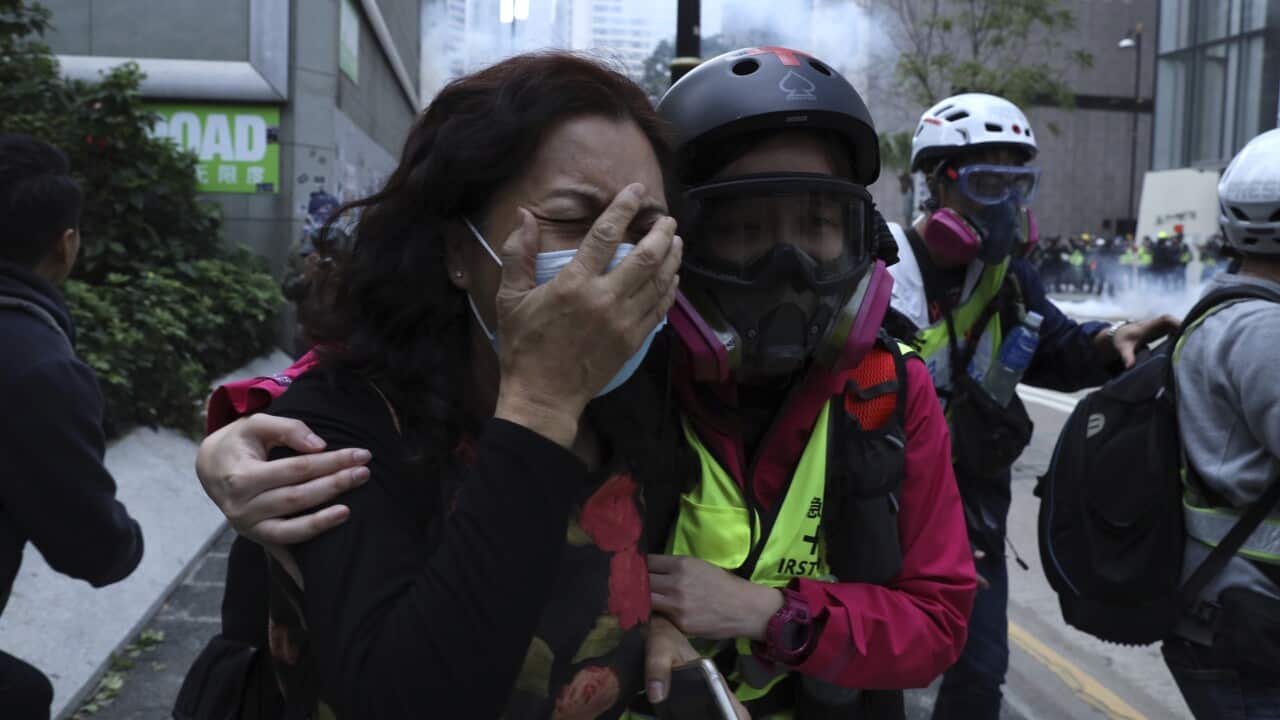Riot fired tear gas to disperse the crowds.