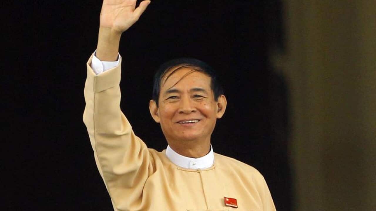 Win Myint, newly elected president of Myanmar, waves to media.