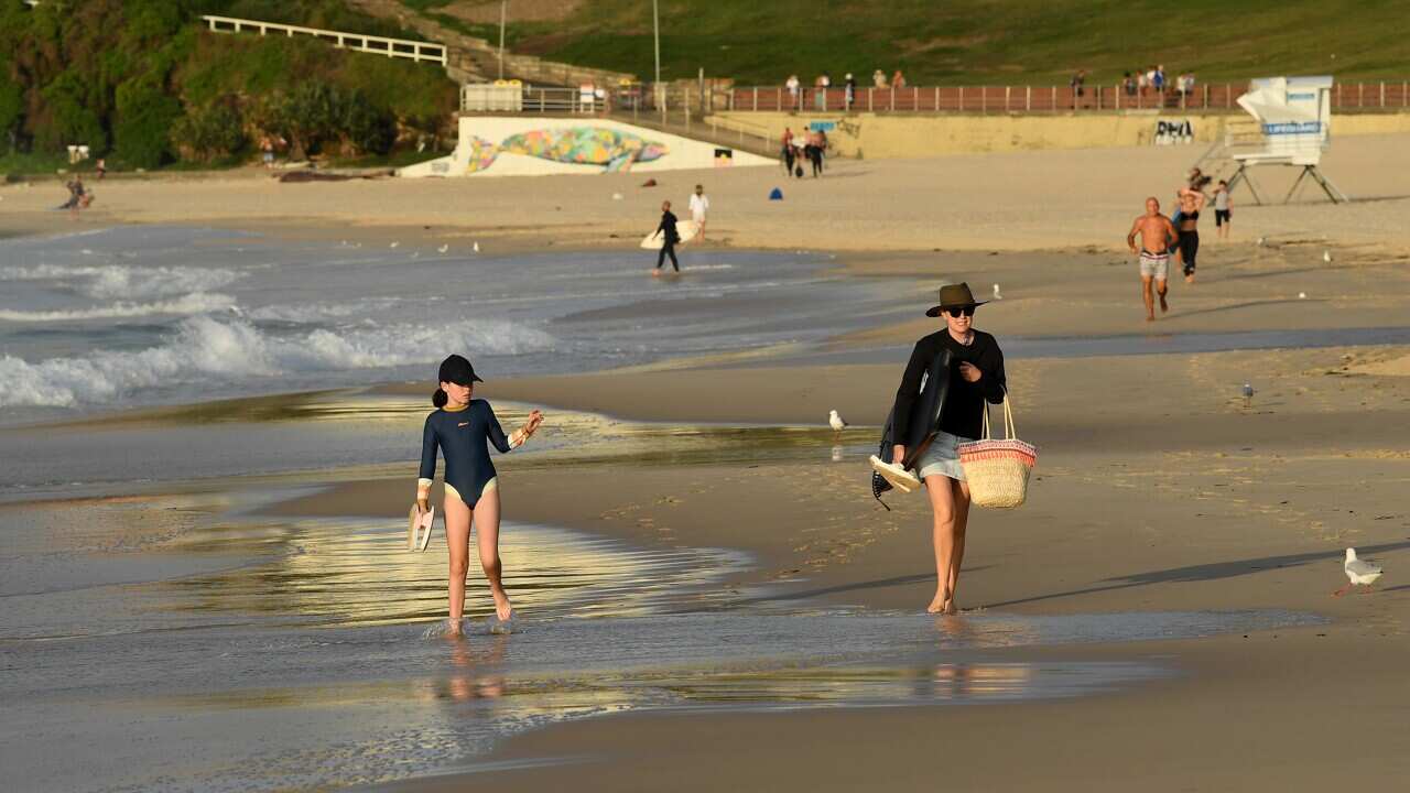 Beachgoers at sunrise at Bondi Beach in Sydney on Sunday morning.