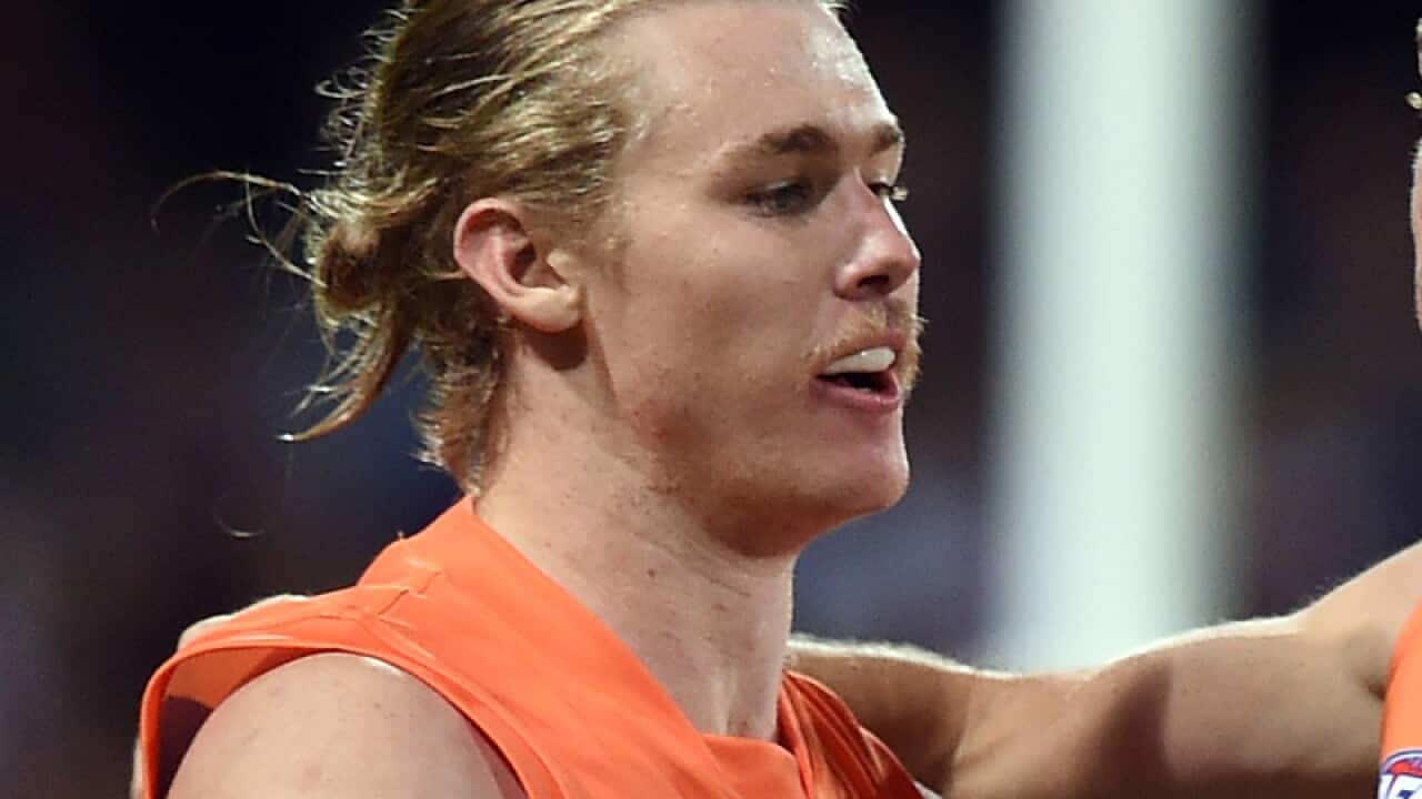 Cam McCarthy (left) of the Giants