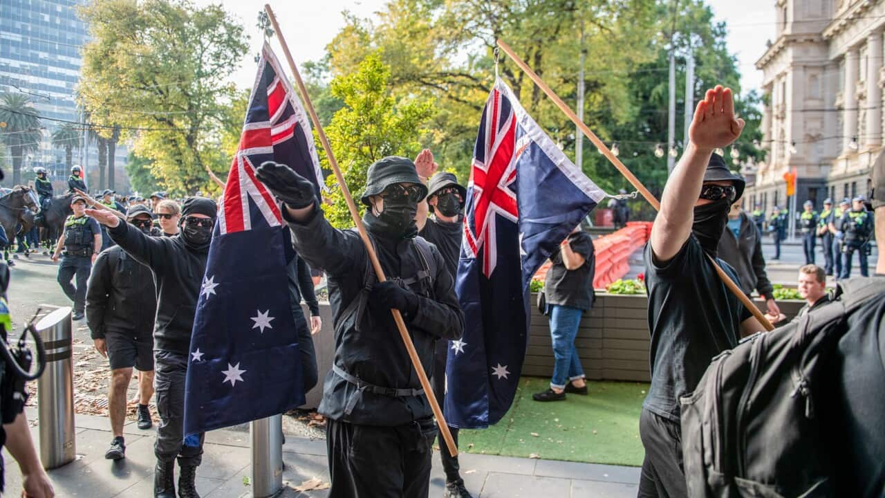 Neo-Nazi protesters salute as they are ordered to leave during a demonstration in Melbourne in May 2023
