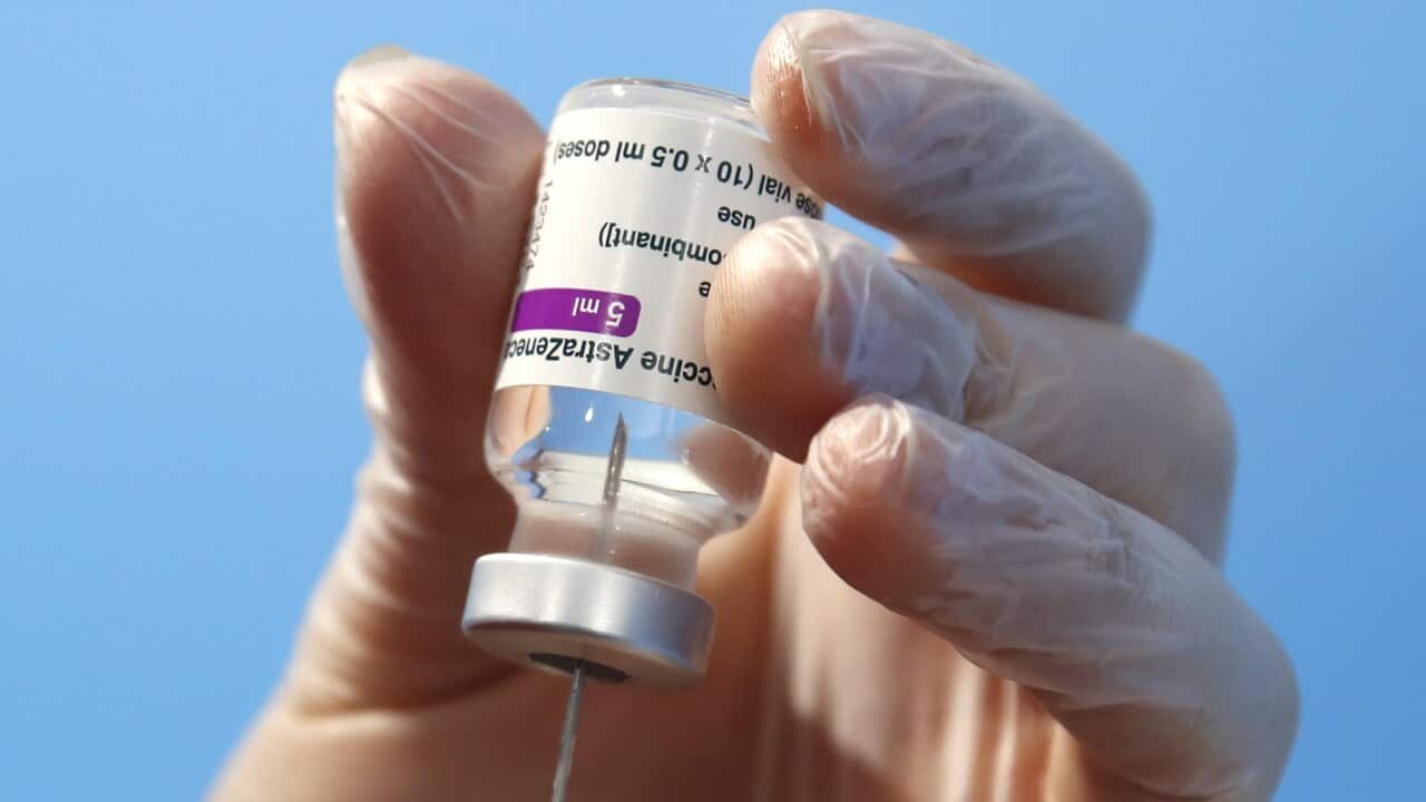 A health worker prepares a dose of the AstraZeneca vaccine.