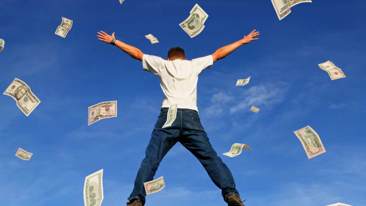 Happy Jumping Man with Falling Dollar Banknotes