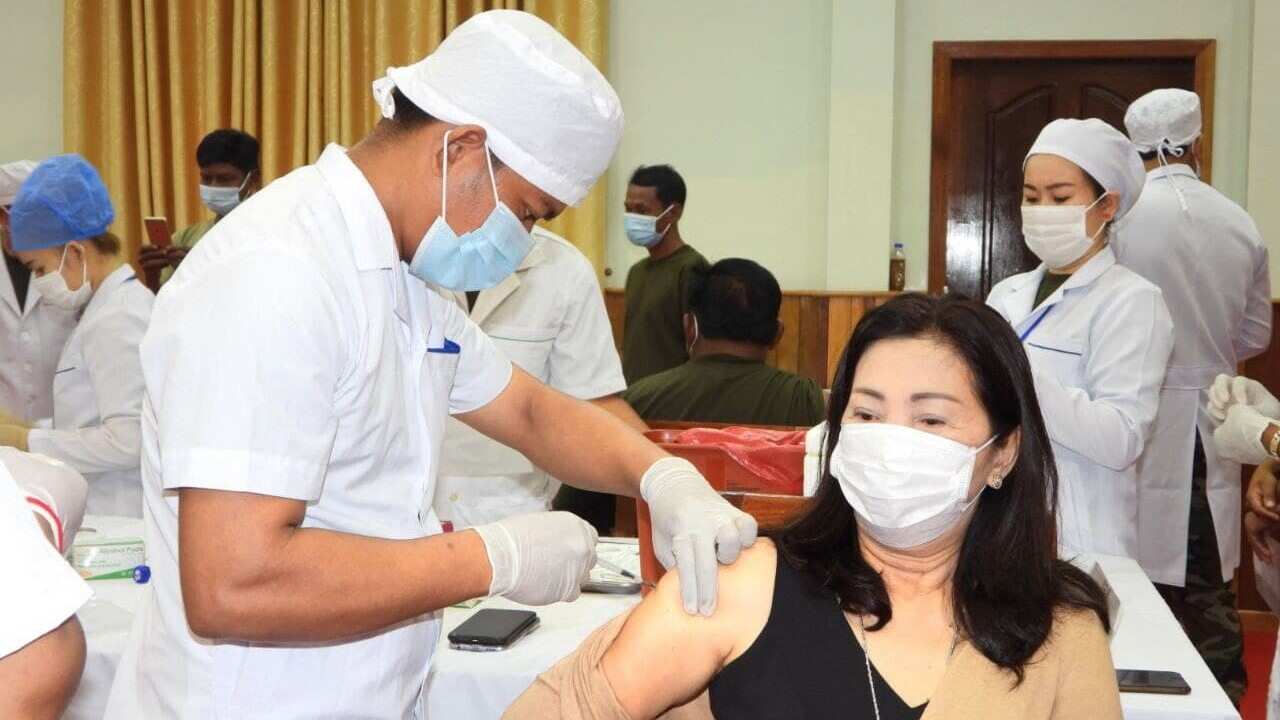 Medical staff administering the vaccine