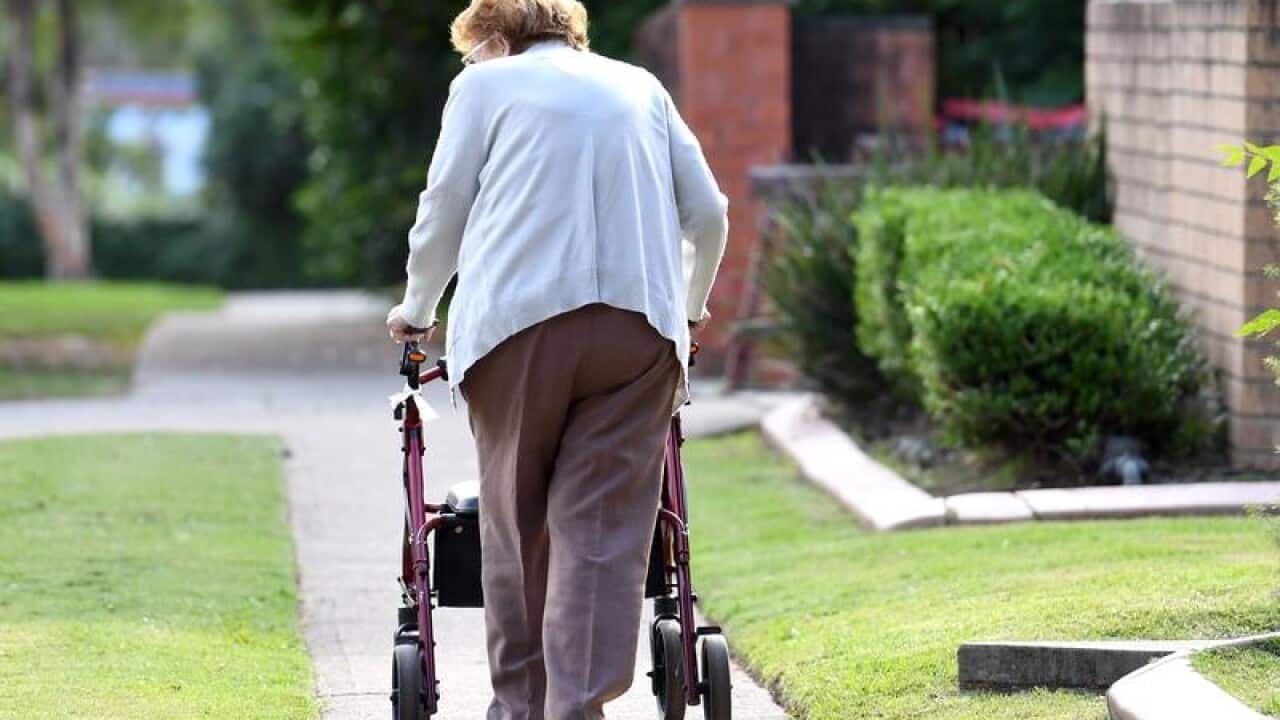 An elderly woman uses a mobility walker in Sydney (file image)