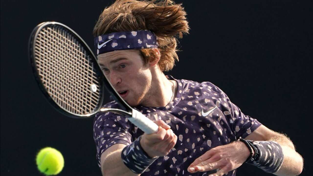 Russia's Andrey Rublev makes a forehand return to Japan's Yuichi Sugita during their second round singles match at the Australian Open tennis championship in Melbourne, Australia, Thursday, Jan. 23, 2020. (AP Photo/Lee Jin-man)