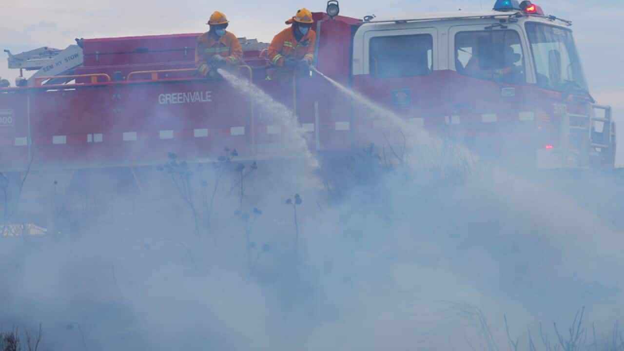 Firefighters battle a fire
