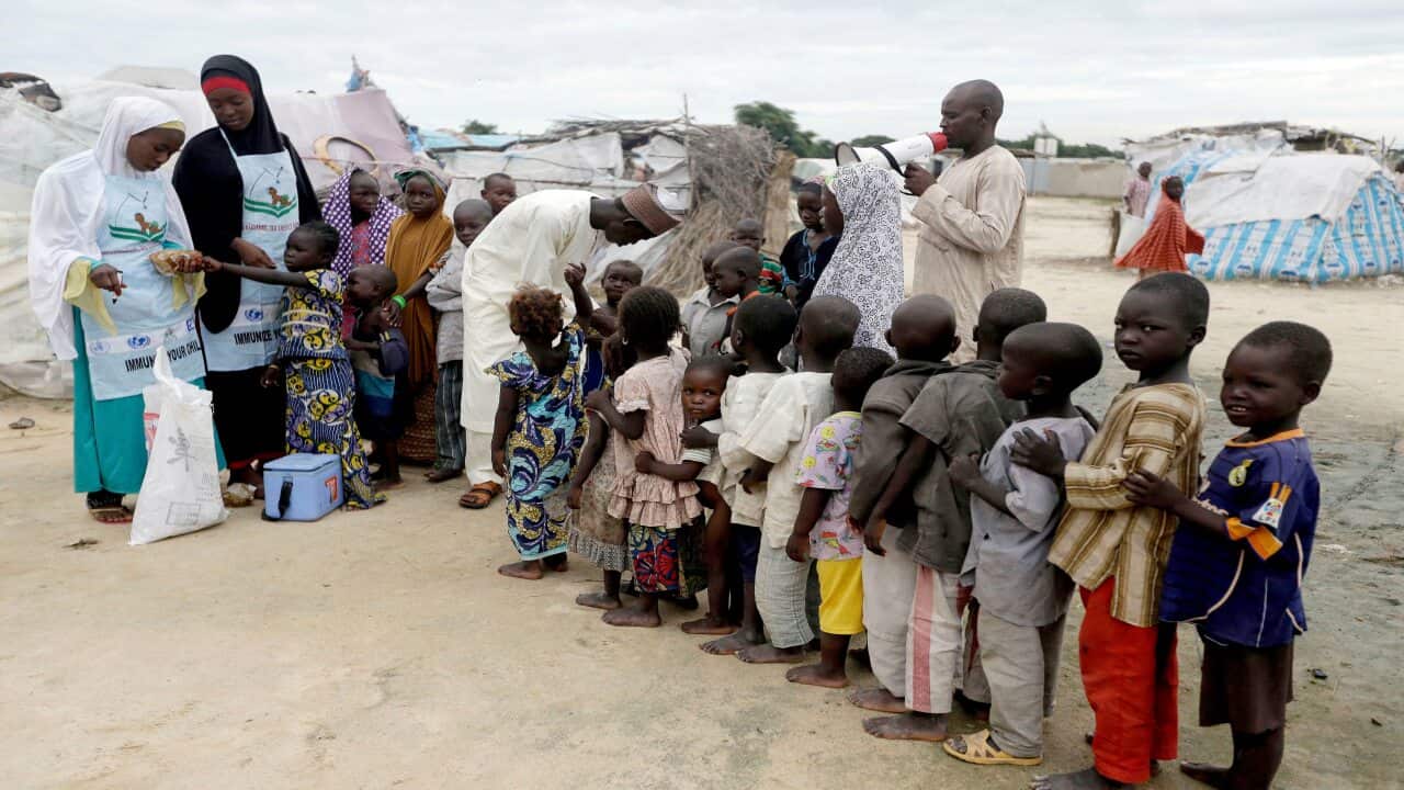 A file photo of health officials administering polio vaccine to children at a camp for people displaced by Islamist extremists in Maiduguri, Nigeria.