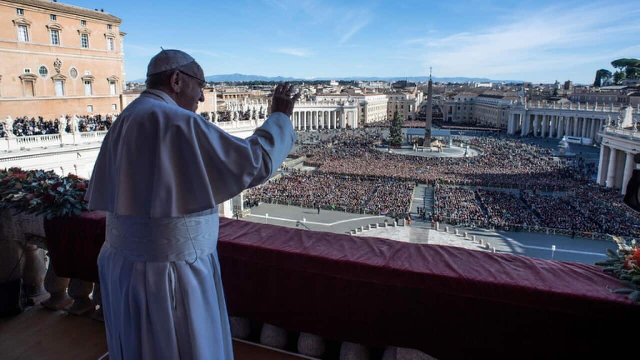 Pope Francis delivering the traditional Urbi et Orbi Christmas Day blessing at the Vatican
