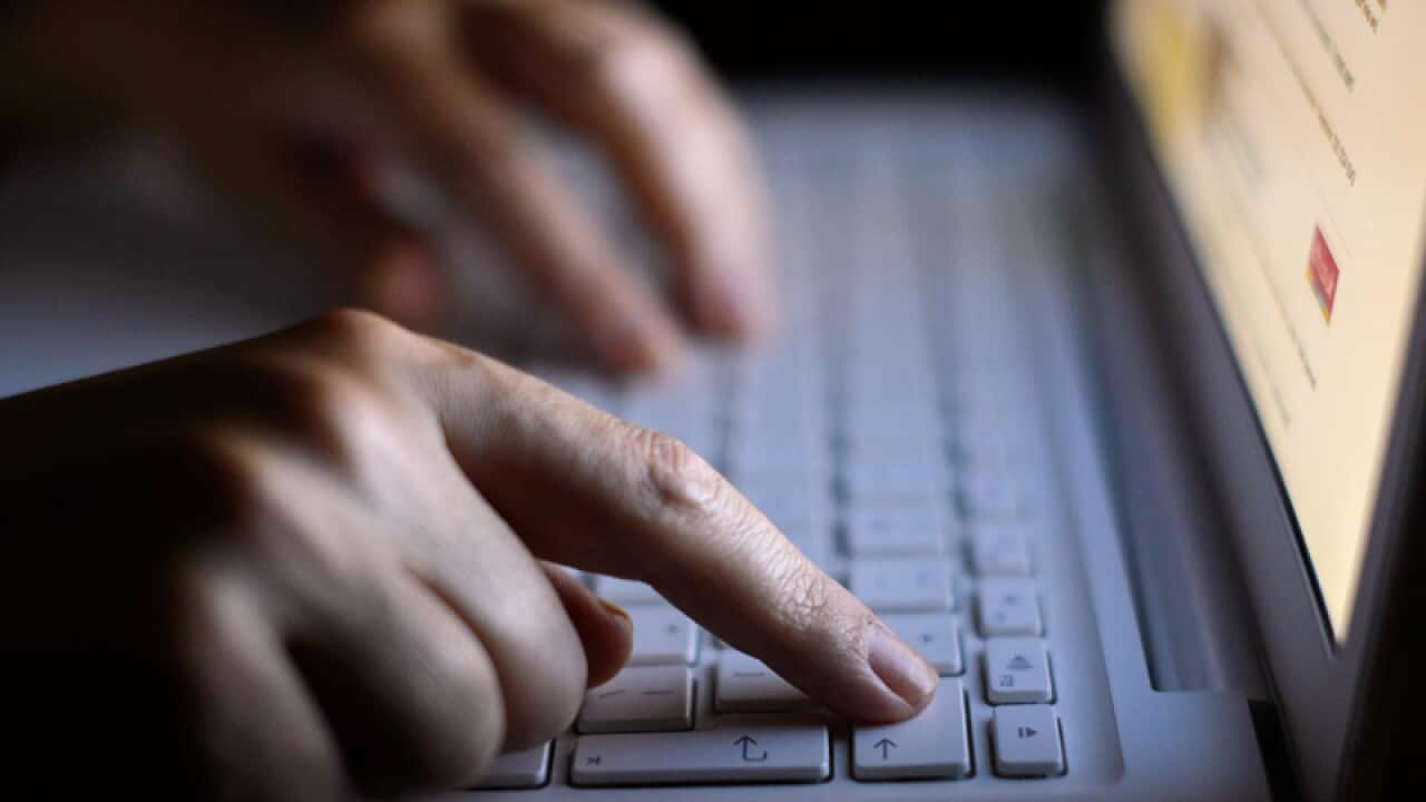 a woman using a laptop