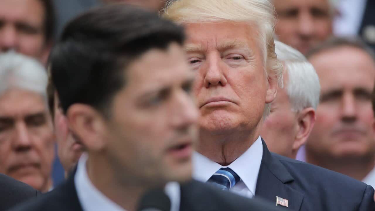 U.S. President Trump listens to Speaker Ryan as he gathers with Republican House members after healthcare bill vote at the White House in Washington