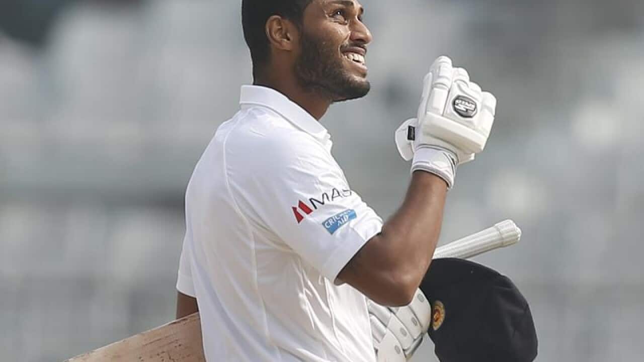 Sri Lankan batsman Roshen Silva reacts after scoring a century